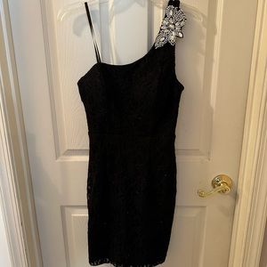 This is a black mini dress designed by City Triangle